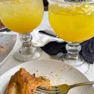 a plate of food and a glass of orange juice