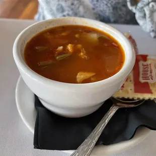 a bowl of soup and crackers