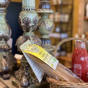 a basket of olives and a bottle of ketchup