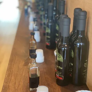a row of bottles of olive oil
