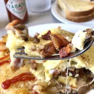 a slice of omelet with bacon and mushrooms