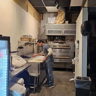 a man working in a commercial kitchen