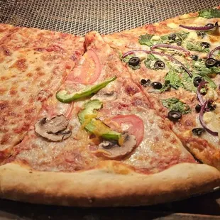 a pizza with a slice taken out of it