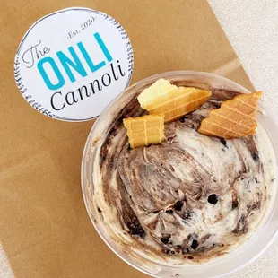 a bowl of ice cream and waffles