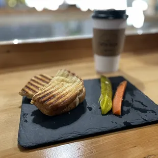 a sandwich and pickles