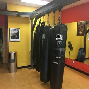 Our group fitness room has bags mounted on rollers so they push out-of-the-way easily.