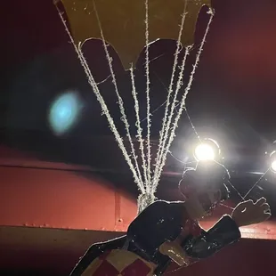 Parachute guy right above the dinner table