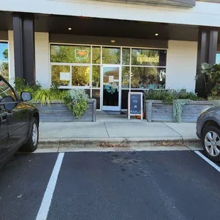 a car parked in front of a store