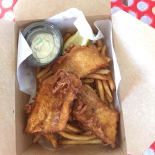 Huge pieces of fish on a nest of perfect fries