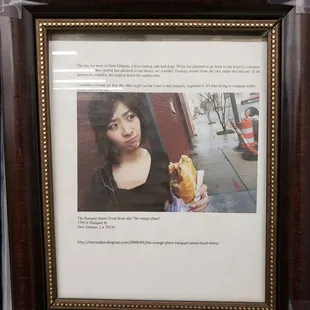 a woman holding a hot dog