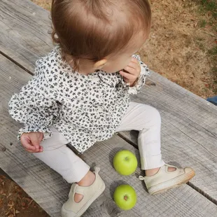 little girl with little apples