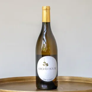 a bottle of wine on a tray