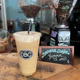 a cup of coffee and a grinder