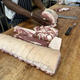 a butcher cutting meat