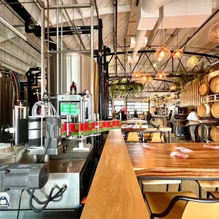 Beer brewing equipment to the left. Dining area to the right.