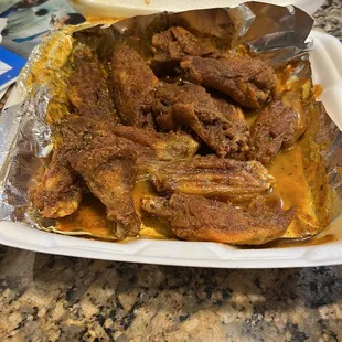 a chicken dish in a styrofoam container