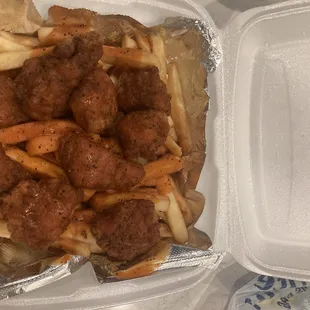 Boneless walk of beaver falls on a bed of fries