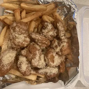 Boneless garlic butter parm on a bed of fries