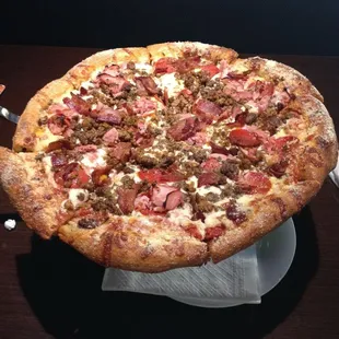 Meat pizza that will is over the top delicious.