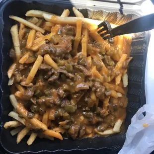 Smothered Green chile fries with steak !!