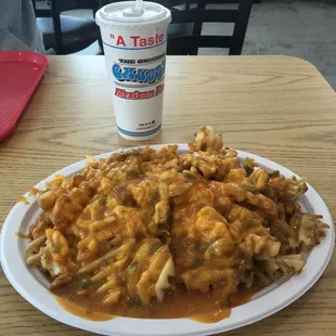 a plate of fries and a drink