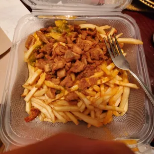 Chile fries with a half of spoon of chile.