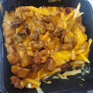Smothered fries with chichrones