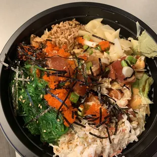 Poke bowl with salmon, tuna, and yellowtail