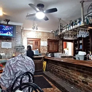 customers sitting at the bar