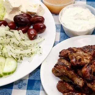 a plate of meat and salad