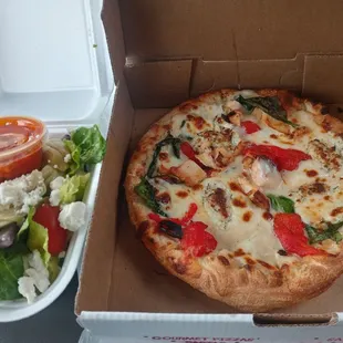 a salad in a styrofoam container