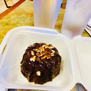 a half eaten dessert in a styrofoam container