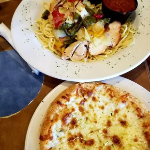 Chicken Cacciatore served with a salad and bread pie.