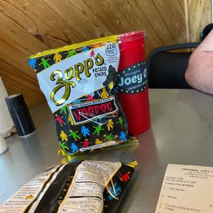 a bag of chips and a drink