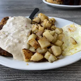 Chicken fried steak with home fries