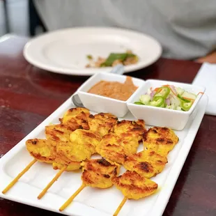 Chicken satay with savory peanut sauce &amp; cucumber salad
