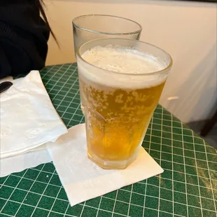 a glass of beer on a table
