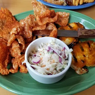 Chicken with Carolina Mustard. Sides of coleslaw and porky chips.