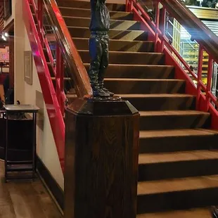 a statue of a man on the stairs