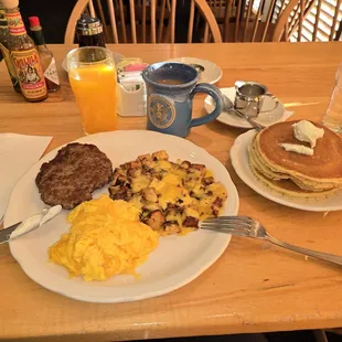 Sausage, scrambled eggs and home fries with cheese.
