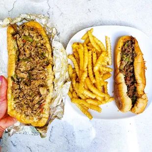 Regular chicken cheesesteak, side of seasoned fries, and half cheesesteak. IG: @take.a.bite.with.me