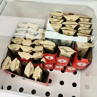 a display case full of pizzas