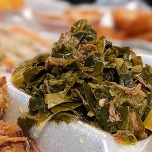 Close-up of collard greens. Side to a plate.