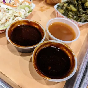 Barbecue sauces. Clockwise from left: Sweet, vinegar, sweet and spicy.