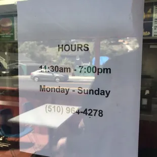 a restaurant hours sign