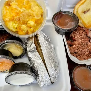 Baked potato, huge chopped brisket sandwich, and peach cobbler. So good!!