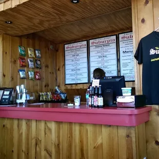 She is getting the sandwiches from a door in the wall, kind of weird.