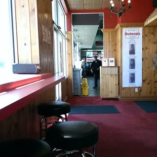 Small window seating looking into the gas station.