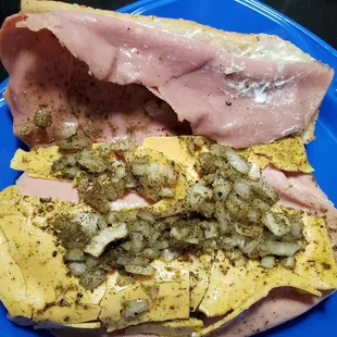 Not sure if the oil has a good amount of spices in it or those come with the onions.  Lots of cheese, enough meat and heavy on the oil.