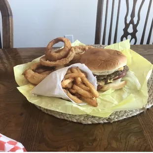 Double guacamole burger with fries and onion rings!